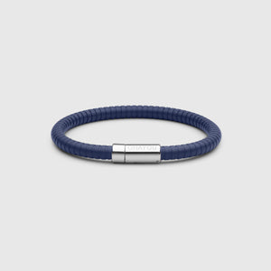 The rubber bracelet in blue with stainless steel clasp. FKM fluoroelastomer rubber – Fully waterproof. White background.