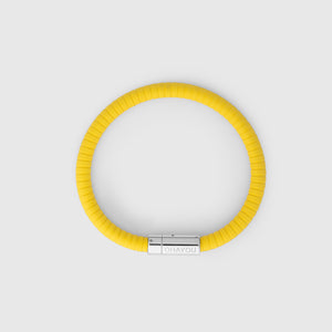 The rubber bracelet in yellow with stainless steel clasp. FKM fluoroelastomer rubber – Fully waterproof. White background, seen from above.